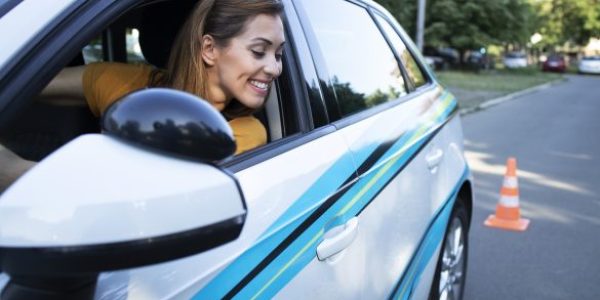 woman-learning-to-drive-car-and-going-reverse-585x390